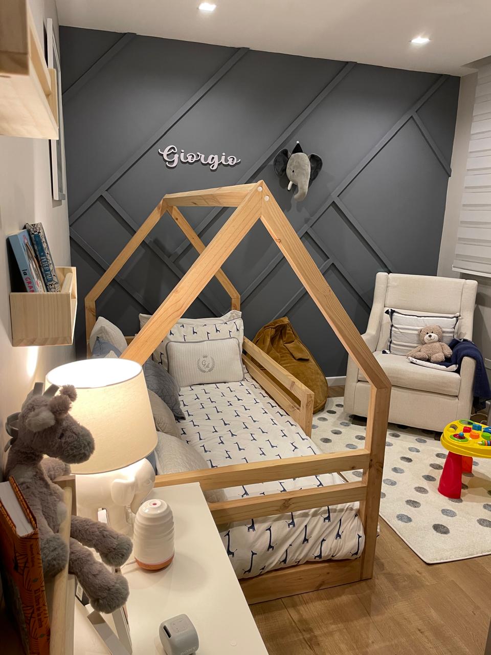 House-frame bed next to decorative panel and reading chair — Giorgio's Room